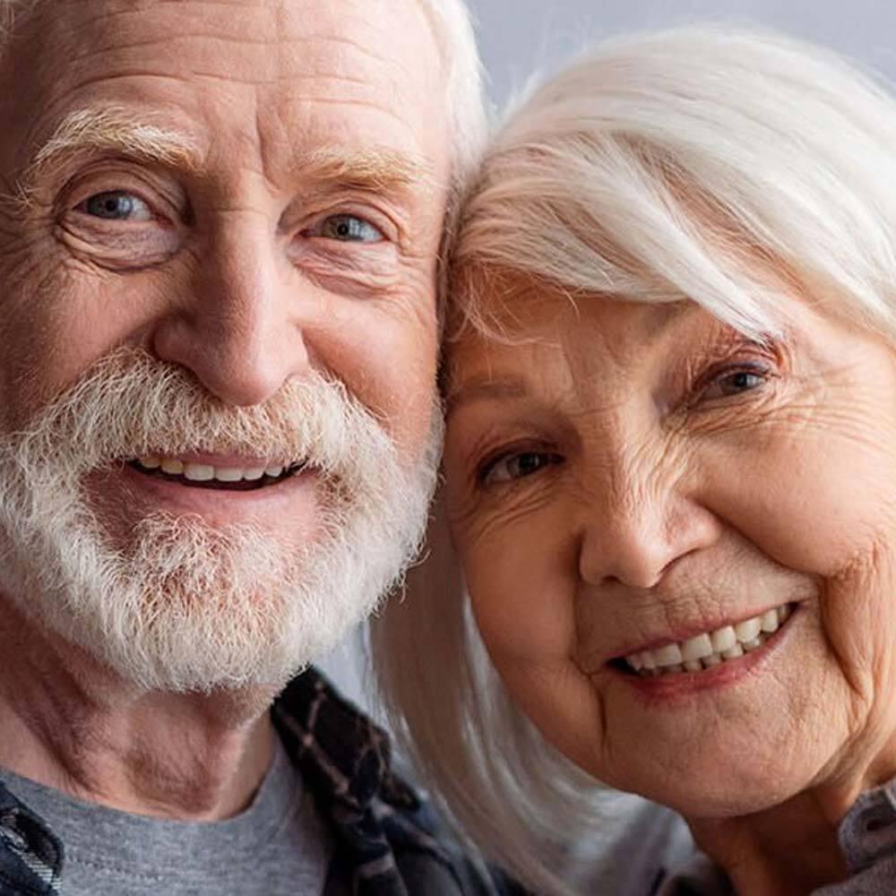 Portrait of Smiling Senior Couple after a Visit to One Eleven Dental