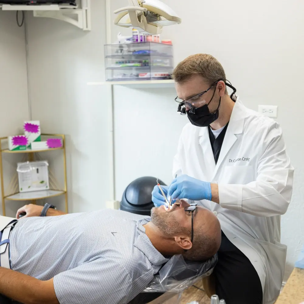 img-Fillings Portrait of Family Looking into the Camera and Smiling Playfully after Visiting One Eleven Dental Care
